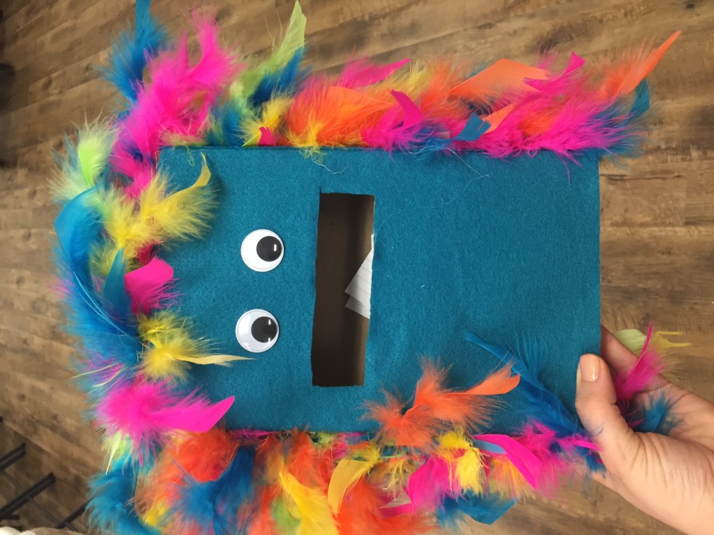 The Braille Monster, a blue cereal box with eyes and a mouth to accept index cards